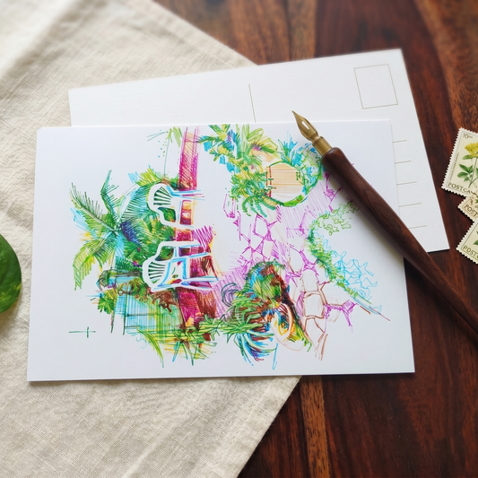 A colorful abstract art print or postcard featuring a vibrant collage of green tropical leaves, pink and purple brushstrokes, and white chair silhouettes, styled on a wooden table with a fountain pen, linen cloth, and postage stamps.